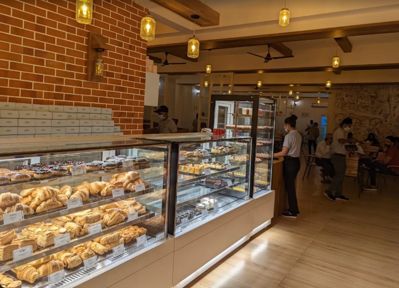 The bakery counter and warm brick interior at Glen's Bakehouse, Lavelle Road